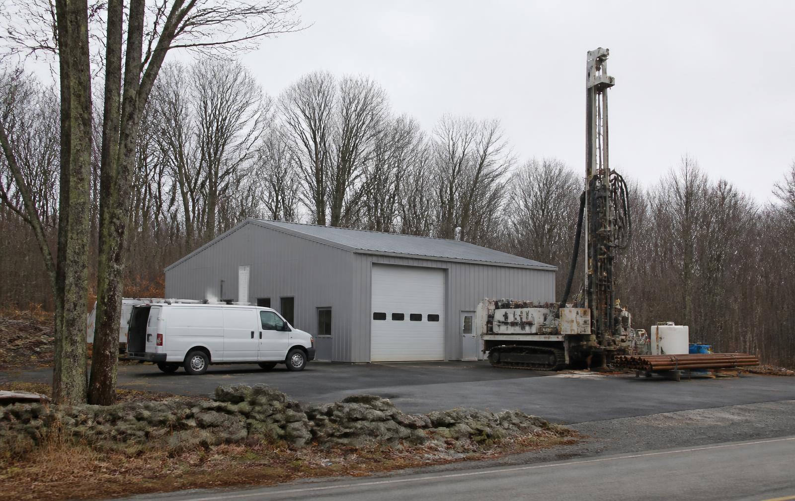 Republic Drill Co. Northeast service depot in Lisbon, Connecticut with a track-mounted geothermal rig and service van